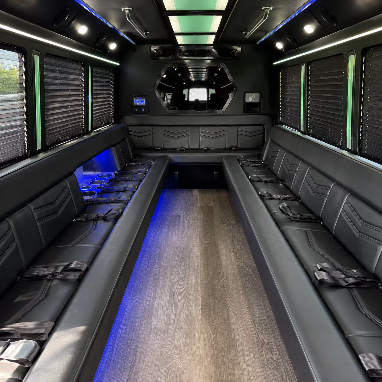 Group beside a Mercedes Sprinter limo in West Jordan